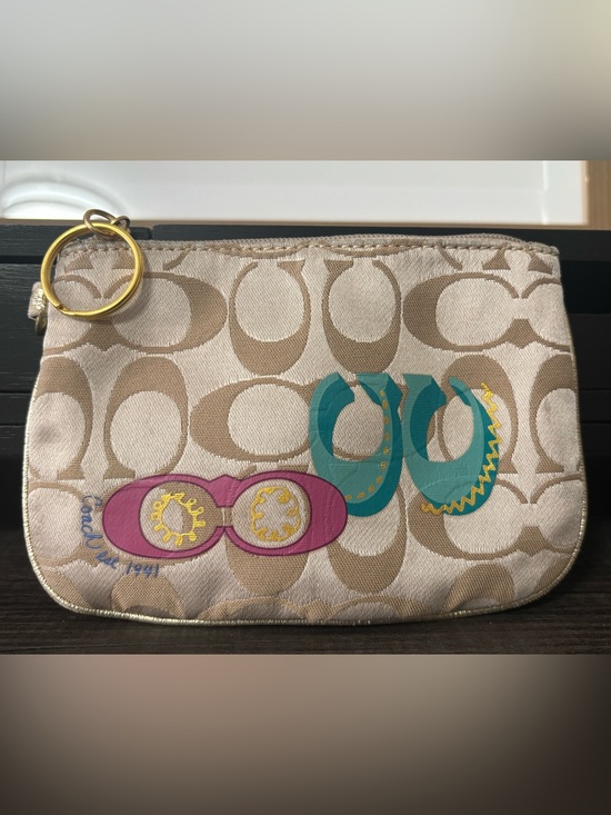 Coach Handbags - Coach Beige Signature Canvas Wristlet with Teal and Magenta Logo